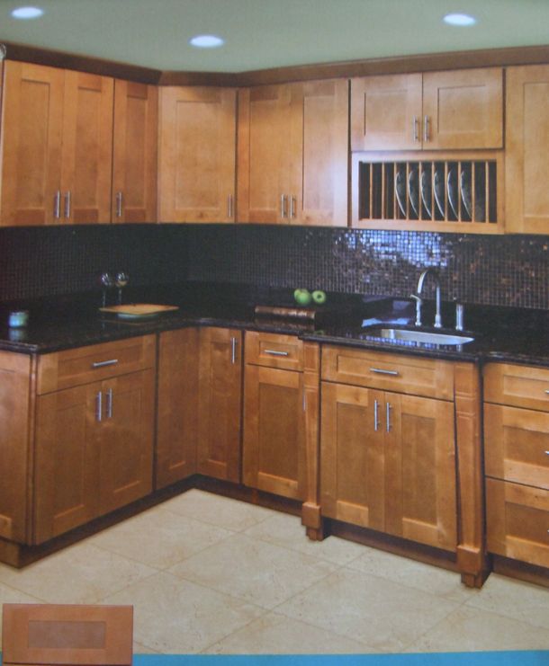 This cherry kitchen features Quality Custom Cabinetry in a Craftsman 